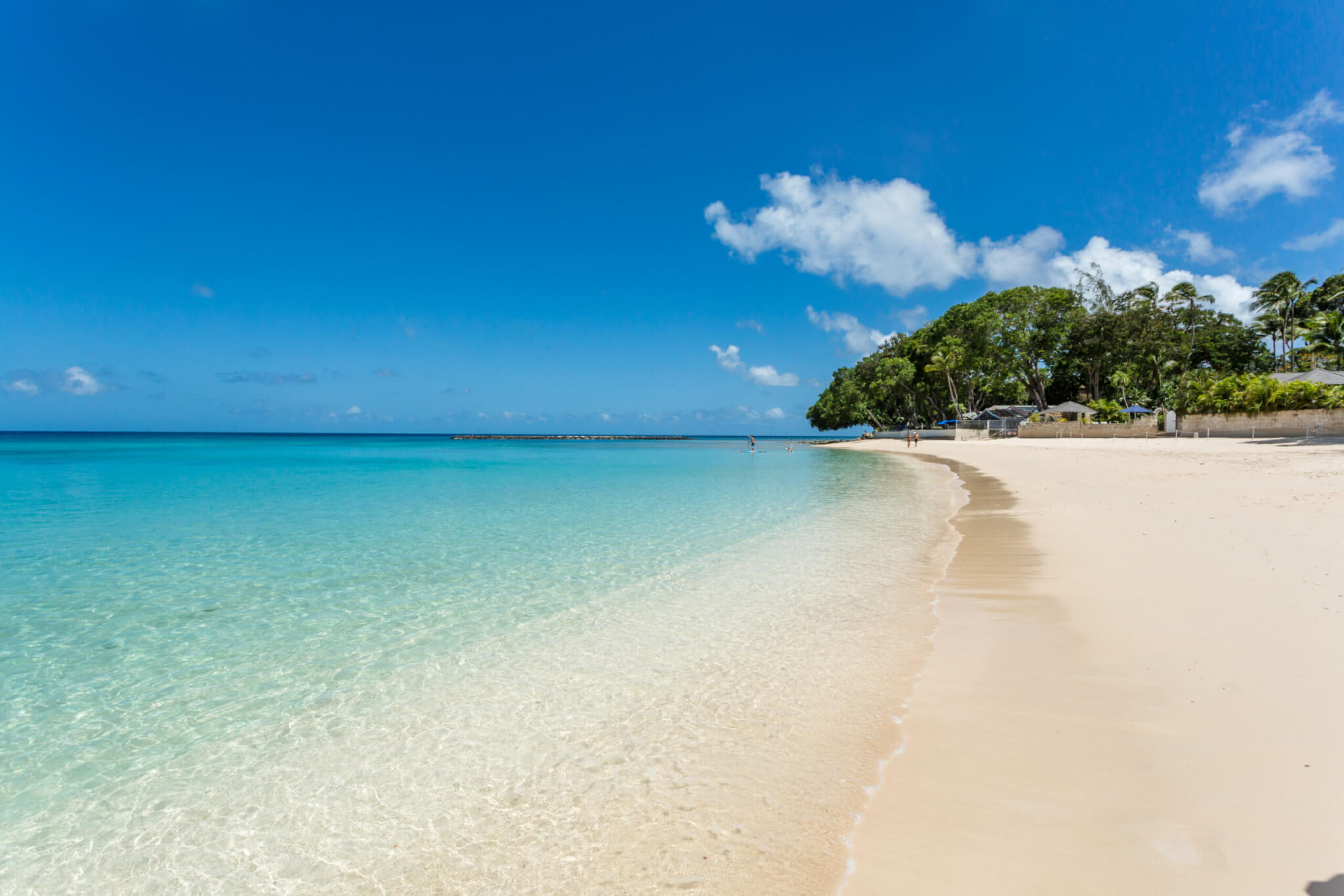 Long beach with white sand and turquoise water