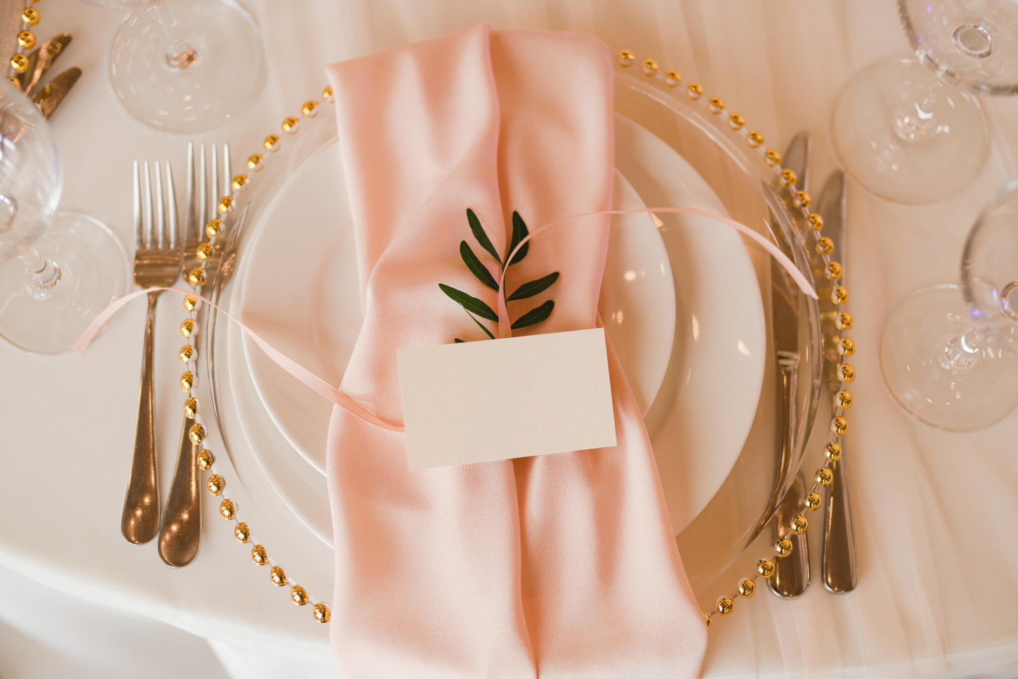 Plate with a neatly folded napkin with an seating card on top