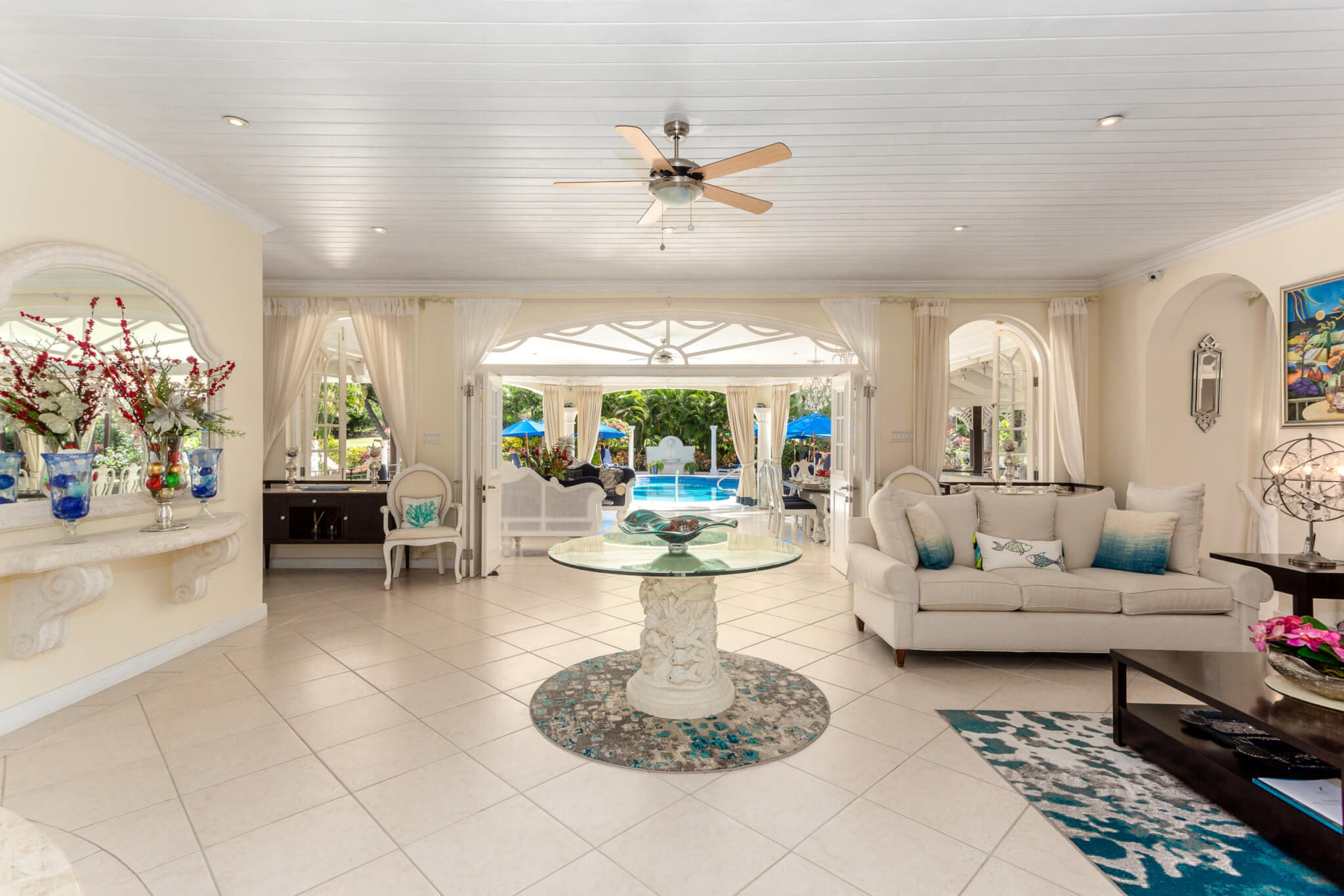 Large entrance room with a small table in the centre with a glass top